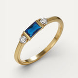 Gold Ring with Stunning Blue Centre Stone and Sparkle