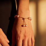 Gold Bracelet with Pink Pearls
